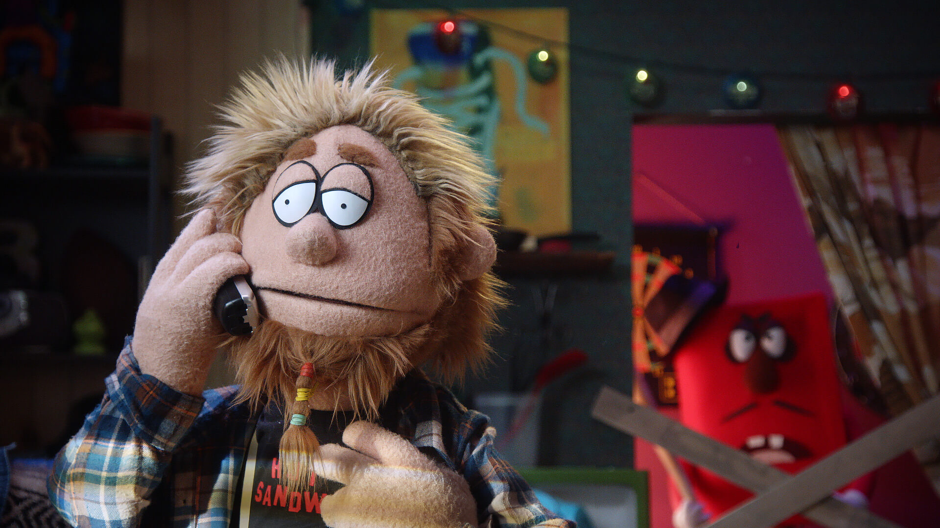 Bobby Fletcher gets a visit from his bookie in a scene from Comedy Central's Crank Yankers directed by Todd Bishop